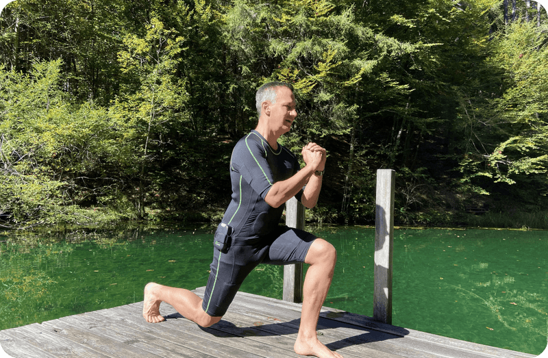 A couple exercising with EMS suit in the rainforest